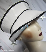 summer rain hat, black and white, crocodile imitation, elegant woman